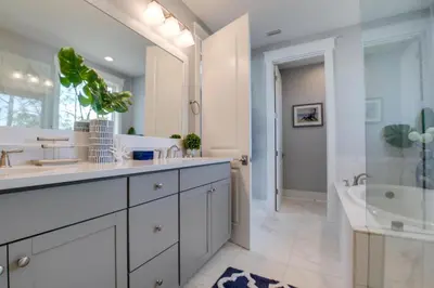 a bathroom with two sinks and a shower and a tub at Last Call at NatureWalk 30A in Seagrove Beach