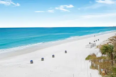 an empty beach with the ocean in the background at Seychelles 308 in Panama City Beach