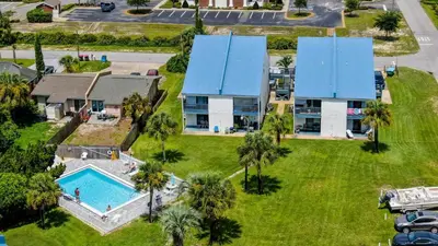 an aerial view of a house with a swimming pool at Salt Life Loft by Sand Seeker Vacations in Panama City Beach