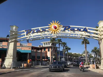 a sign over a street in front of a building at Salt Life Loft by Sand Seeker Vacations in Panama City Beach
