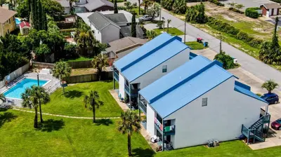 an aerial view of a house with a blue roof at Salt Life Loft by Sand Seeker Vacations in Panama City Beach