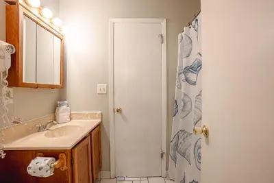 a bathroom with a sink and a shower at Sweet Retreat by Sand Seeker Vacations in Panama City Beach