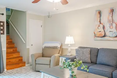 a living room with a couch and a chair at Sweet Retreat by Sand Seeker Vacations in Panama City Beach