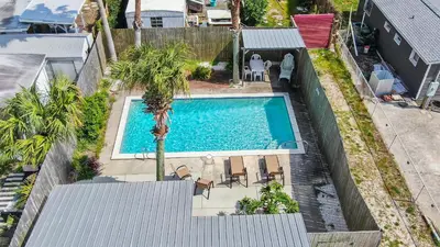 an overhead view of a swimming pool in a backyard at Laguna Shores by Sand Seeker Vacations in Panama City Beach