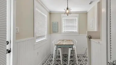 a dining room with a table and chairs at Laguna Shores by Sand Seeker Vacations in Panama City Beach