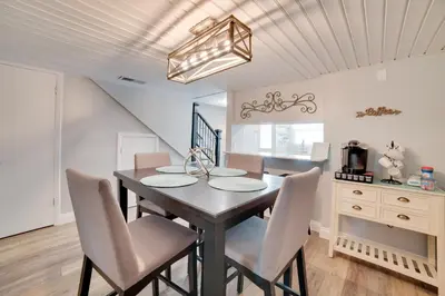 a dining room with a table and chairs at PCB Townhome Walk to Beaches, Resort Amenities! in Panama City Beach