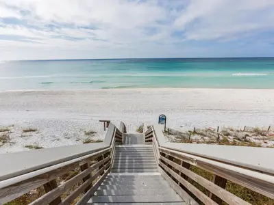 a staircase leading to a beach with the ocean at Prominence on 30A Pet Friendly Vacation Rentals by Panhandle Getaways in Watersound Beach