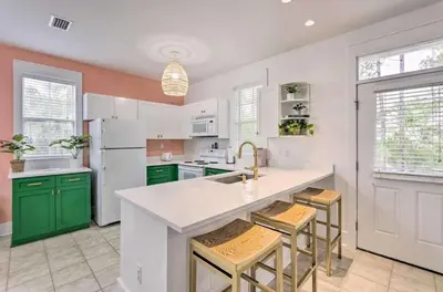 a kitchen with green cabinets and a white refrigerator at Easy Walk to Seagrove Beach Beverly Bungalow in Santa Rosa Beach