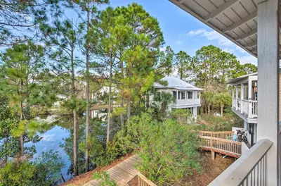 a home with a view of the water and trees at Easy Walk to Seagrove Beach Beverly Bungalow in Santa Rosa Beach