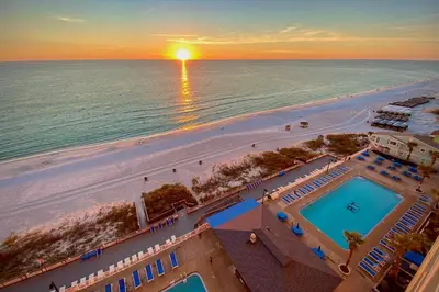an aerial view of the beach and the ocean at PCB Condo with Community Perks and Beach Access in Panama City Beach