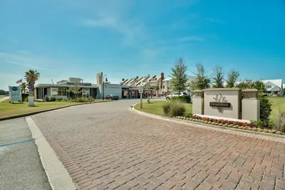 a cobblestone street in a town with houses at Happily Eva After at Prominence 30A in Inlet Beach