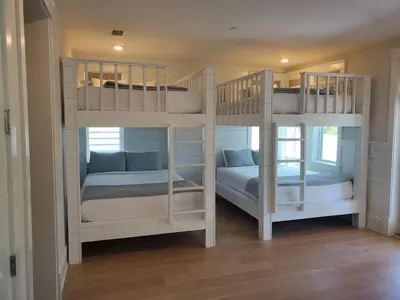 two white bunk beds in a room at Happily Eva After at Prominence 30A in Inlet Beach