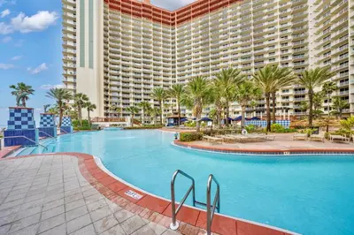 a large swimming pool in front of a large building at Shores of Panama Resort, Direct Beachfront, 1 BR plus Bunks! by Dolce Vita Getaways PCB in Panama City Beach