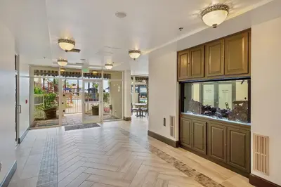 an empty lobby with a large door and a hallway at Shores of Panama Resort, Direct Beachfront, 1 BR plus Bunks! by Dolce Vita Getaways PCB in Panama City Beach