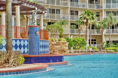 a swimming pool in front of a resort at Shores of Panama Resort, Direct Beachfront, 1 BR plus Bunks! by Dolce Vita Getaways PCB in Panama City Beach