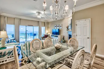 a dining room with a table and chairs at Beachside #8 - Beachfront - Sleeps 10! in Panama City Beach