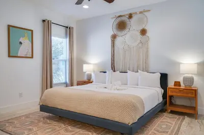a bedroom with a large bed and a window at Panama City Beach House - The Starfish by Panhandle Getaways in Panama City Beach