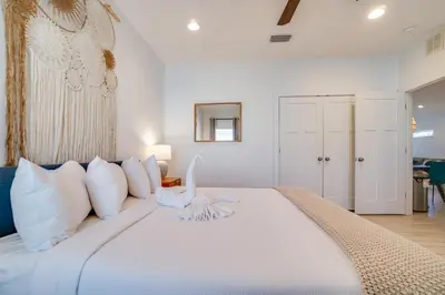 a bedroom with a large white bed with white pillows at Panama City Beach House - The Starfish by Panhandle Getaways in Panama City Beach