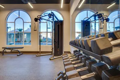a gym with rows of chairs and windows at Calypso Resort Tower 3 by Panhandle Getaways in Panama City Beach