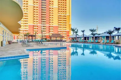 a large swimming pool in front of a large building at Calypso Resort Tower 3 by Panhandle Getaways in Panama City Beach