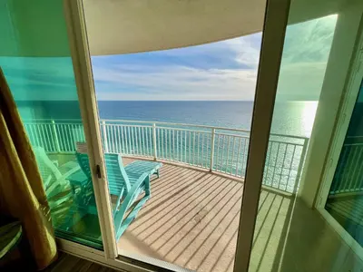 a balcony with a view of the ocean at AQUA RESORT! Beachfront, 3 Bedroom Condo! 2 Bedrooms Beach Front! Sleeps 7! Free Beach Chairs by Dolce Vita Getaways PCB in Panama City Beach