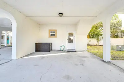 an empty house with a large concrete patio at Renovated PCB Studio, 2 Min Walk To Laguna Beach! in Panama City Beach
