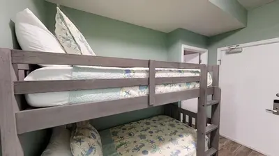 a bedroom with two bunk beds in a room at Tidewater 704 in Panama City Beach