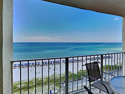 a balcony with a view of the beach at Regency Towers Panama City Beach #719 in Panama City Beach