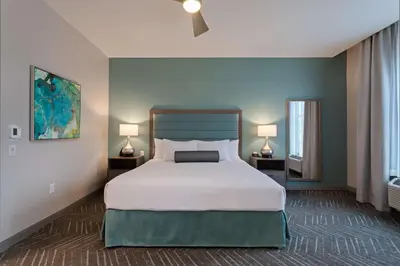 a bedroom with a large bed and two lamps at Homewood Suites By Hilton Panama City Beach, Fl in Panama City Beach