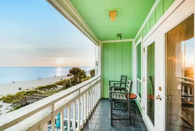a balcony with chairs and a view of the beach at The Shell Shack #3 by Sand Seeker Vacations in Panama City Beach