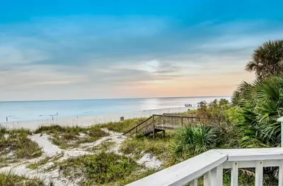 a view of the beach from the balcony of a beach house at The Shell Shack #3 by Sand Seeker Vacations in Panama City Beach