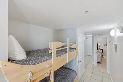 a bedroom with two bunk beds in a room at Calypso Resort Beachfront Condo in Panama City Beach