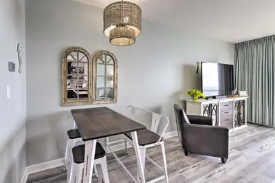 a dining room with a table and chairs at Panama City Beach Condo with Free Beach Service! in Panama City Beach