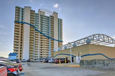a parking lot in front of a large building at Panama City Beach Condo with Free Beach Service! in Panama City Beach