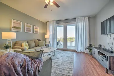 a living room with a couch and a tv at Lagoon-View Balcony! Family Resort Escape in PCB in Panama City Beach
