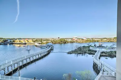 a bridge over a river with a city in the background at Lagoon-View Balcony! Family Resort Escape in PCB in Panama City Beach