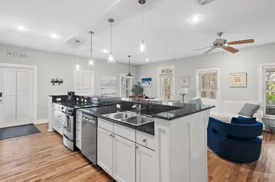 a kitchen with a sink and a counter top at Beach Bungalow, 3 Min Walk to Beach, Golf Cart, 4 bikes, Wagon in Seacrest