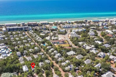 an aerial view of a resort next to the ocean at Beach Bungalow, 3 Min Walk to Beach, Golf Cart, 4 bikes, Wagon in Seacrest