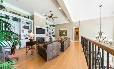a living room with two couches and a fireplace at En Soleil #1522 West in Panama City Beach