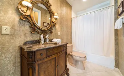 a bathroom with a sink and a mirror on the wall at En Soleil #1522 West in Panama City Beach