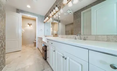 a bathroom with a large sink and a mirror at En Soleil #1522 West in Panama City Beach