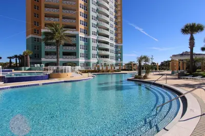 a large swimming pool in front of a building at En Soleil #1522 West in Panama City Beach