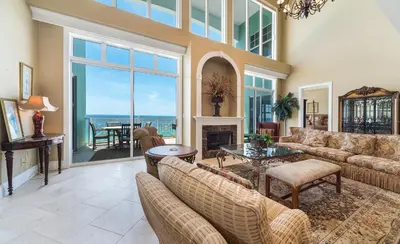 a living room with a couch and a fireplace at En Soleil #1522 West in Panama City Beach