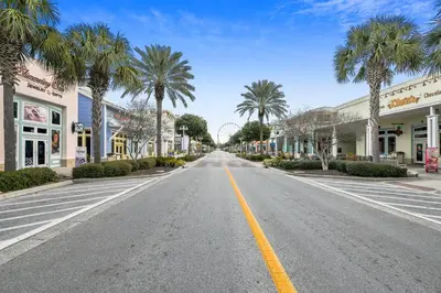 an empty street in a town with palm trees at Boardwalk Beach Resort #1403 by Book That Condo in Panama City Beach