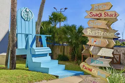 a sign for a resort with a blue staircase at Top of The Gulf 213 in Panama City Beach