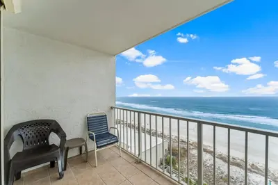 a balcony with a view of the ocean at The Summit 1031 in Panama City Beach