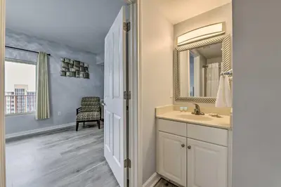 a bathroom with a sink and a mirror at Oceanfront PCB Resort Condo with Balcony and Views! in Panama City Beach