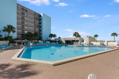 a large swimming pool in front of a hotel at Top Of The Gulf 111 in Panama City Beach