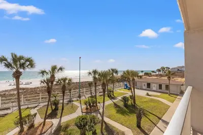 a view of the beach from the balcony of a condo at The Summit 306 in Panama City Beach
