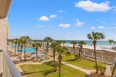 a view of the beach from the balcony of a resort at The Summit 306 in Panama City Beach